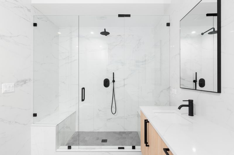 Sleek Black Fixtures and Frameless Glass